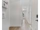 Bright hallway with neutral walls and light hardwood flooring at 8484 Sperry St, Orlando, FL 32827