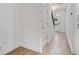 Bright hallway with neutral walls and light hardwood flooring at 8484 Sperry St, Orlando, FL 32827
