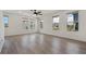 Bright living room featuring hardwood flooring and large windows at 8484 Sperry St, Orlando, FL 32827
