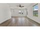 Spacious living room with hardwood floors, lots of light, and neutral walls at 8484 Sperry St, Orlando, FL 32827