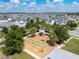 Aerial view of a neighborhood playground featuring a slide, climbing structure and green space at 8484 Sperry St, Orlando, FL 32827