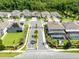 Aerial view of a neighborhood with well-maintained homes, a pool and beautiful landscaping at 977 Talon Pl, Winter Springs, FL 32708