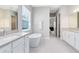 Elegant bathroom with double vanities, a freestanding tub, and natural light from the window at 977 Talon Pl, Winter Springs, FL 32708