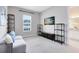 Comfortable bonus room featuring built-in shelves and a calming view from the window at 977 Talon Pl, Winter Springs, FL 32708