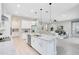 Open-concept kitchen featuring a large island with granite countertops and stainless steel appliances at 977 Talon Pl, Winter Springs, FL 32708