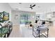 Bright living room with modern furniture, stylish decor, view of the backyard, and open layout, creating an inviting atmosphere at 977 Talon Pl, Winter Springs, FL 32708