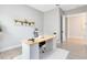 Cozy home office with a stylish desk, comfortable chair, airplane art, and warm decor creates an inspiring workspace at 977 Talon Pl, Winter Springs, FL 32708