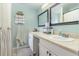 A clean and well-lit bathroom featuring double sinks and ample counter space at 1033 Mccully Ct, Oviedo, FL 32765