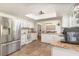 This spacious kitchen has stainless steel appliances, tile floors and granite countertops at 1033 Mccully Ct, Oviedo, FL 32765