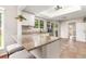 Bright kitchen features granite countertops, stainless steel appliances, and a breakfast bar at 1033 Mccully Ct, Oviedo, FL 32765