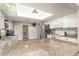 Open kitchen design featuring granite countertops, stainless appliances, and ample natural light at 1033 Mccully Ct, Oviedo, FL 32765