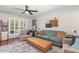 Comfortable living room with plush seating, a ceiling fan, and natural light at 1033 Mccully Ct, Oviedo, FL 32765