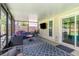Screened-in patio with an outdoor seating area and a view of the yard at 1033 Mccully Ct, Oviedo, FL 32765