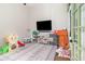 Bright playroom with natural light, featuring various toys and a -friendly setup at 1033 Mccully Ct, Oviedo, FL 32765