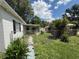 A chain link fence borders the backyard which has a storage shed in the distance at 1047 Clay Blvd, Eustis, FL 32726