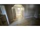 Hallway with access to additional rooms and neutral colored walls at 1047 Clay Blvd, Eustis, FL 32726