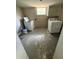 A view of the laundry room with a washer, a dryer and a window at 1047 Clay Blvd, Eustis, FL 32726