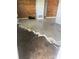 Renovations in progress with newly tiled floors and wood paneled accent walls in the living room at 1047 Clay Blvd, Eustis, FL 32726