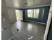 Living room with tiled floors and a view out the front window at 1047 Clay Blvd, Eustis, FL 32726
