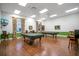 Recreation area with billiard tables, stylish seating, and ample lighting, great for socializing and entertainment at 1104 Sawgrass Dr, Winter Haven, FL 33884