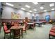 Inviting billiard room with pool tables, ample seating, and a refined atmosphere for relaxation and recreation at 1104 Sawgrass Dr, Winter Haven, FL 33884