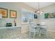 Charming breakfast nook with a round table, pendant lighting, and a bright window at 1104 Sawgrass Dr, Winter Haven, FL 33884
