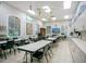 Well-equipped craft room with tables, chairs, storage, and natural light, perfect for creative projects at 1104 Sawgrass Dr, Winter Haven, FL 33884