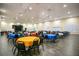 Bright and airy event room with multiple tables and chairs, suitable for various occasions and gatherings at 1104 Sawgrass Dr, Winter Haven, FL 33884