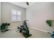 Home gym featuring stationary bike, rowing machine, weights, and carpeted floor at 1104 Sawgrass Dr, Winter Haven, FL 33884