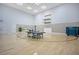 Spacious game room featuring a ping pong table and a basketball hoop for recreational activities at 1104 Sawgrass Dr, Winter Haven, FL 33884