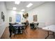 Cozy game room with table, comfortable seating, and a warm ambiance, ideal for entertainment and relaxation at 1104 Sawgrass Dr, Winter Haven, FL 33884