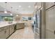 Well-lit kitchen boasting modern appliances, ample cabinetry, and a view of the dining area at 1104 Sawgrass Dr, Winter Haven, FL 33884