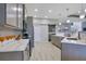 Modern kitchen featuring grey cabinetry, quartz countertops, and stainless steel appliances at 1104 Sawgrass Dr, Winter Haven, FL 33884