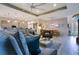 Bright and airy living space with comfortable seating and an adjacent dining area at 1104 Sawgrass Dr, Winter Haven, FL 33884