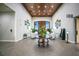 Grand lobby with high ceilings, coffered ceiling, elegant seating, and decorative floral arrangements at 1104 Sawgrass Dr, Winter Haven, FL 33884