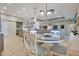 Open-concept living space with breakfast nook, large sectional, and a well-equipped kitchen at 1104 Sawgrass Dr, Winter Haven, FL 33884