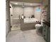 Bathroom featuring a glass-enclosed shower, soaking tub, tiled walls, and modern fixtures at 1165 Baltic Ln, Winter Springs, FL 32708