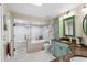 Well-lit bathroom with tub, glass enclosed shower, dual sink vanity and granite countertops at 1165 Baltic Ln, Winter Springs, FL 32708
