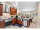 Stylish kitchen featuring stainless steel appliances, granite countertops, and adjacent dining area at 1165 Baltic Ln, Winter Springs, FL 32708