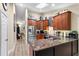 Modern kitchen with stainless steel appliances, granite countertops, and ample storage space at 1165 Baltic Ln, Winter Springs, FL 32708