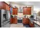Contemporary kitchen boasts stainless steel appliances, granite counters, and plenty of cabinet space at 1165 Baltic Ln, Winter Springs, FL 32708