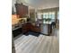 Modern kitchen with stainless steel appliances, granite countertops, an island, and ample natural light from the windows at 1165 Baltic Ln, Winter Springs, FL 32708