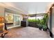 Screened lanai featuring neutral tiling, with views of the lushly landscaped backyard at 1165 Baltic Ln, Winter Springs, FL 32708