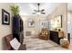 Cozy living room featuring a ceiling fan, plantation shutters, and comfortable seating arrangement at 1165 Baltic Ln, Winter Springs, FL 32708