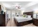 Bright main bedroom features wood-look floors, fireplace, and large windows for a relaxing retreat at 1165 Baltic Ln, Winter Springs, FL 32708