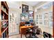 Functional home office featuring a classic desk, built-in bookshelves, and natural light at 1165 Baltic Ln, Winter Springs, FL 32708