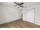 Bedroom boasts sleek wood-look flooring and ample storage with closet at 13031 Ne 7Th Loop, Silver Springs, FL 34488