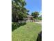 Quaint single-story home surrounded by mature trees and a charming white picket fence at 1307 Mabbette St, Kissimmee, FL 34741