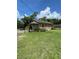 Charming single-story home with a well-manicured lawn and a classic white picket fence at 1307 Mabbette St, Kissimmee, FL 34741
