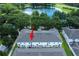Aerial view of townhouses surrounded by mature trees and lush landscaping at 14128 Avenue Of The Grvs, Winter Garden, FL 34787